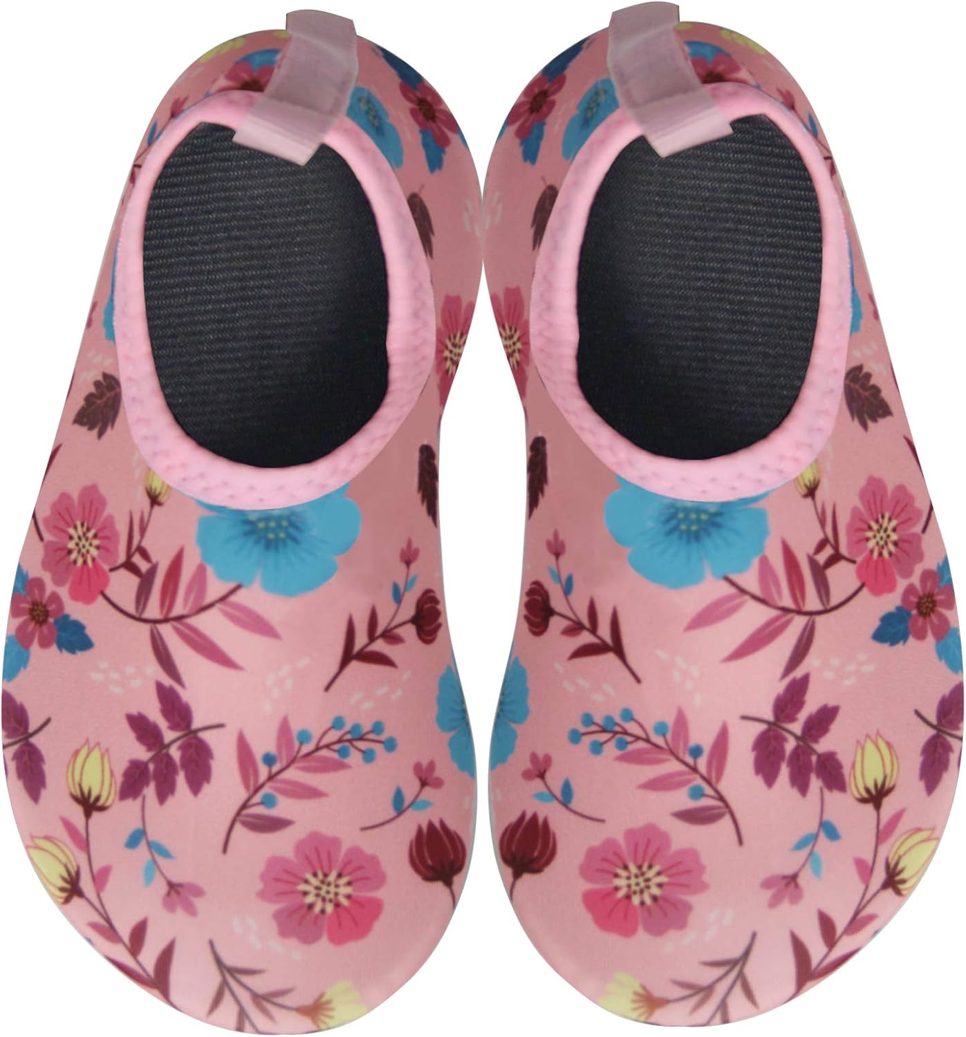 Child wearing Pavo water shoes on a sunny beach